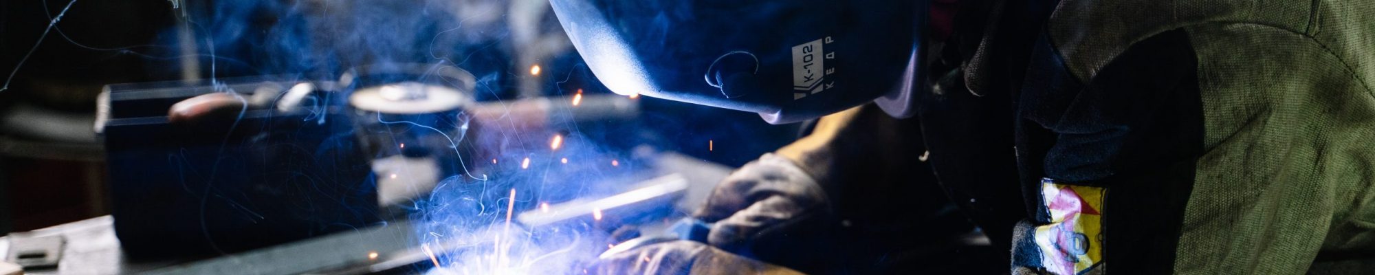 man-welding-metal-bars-2381463